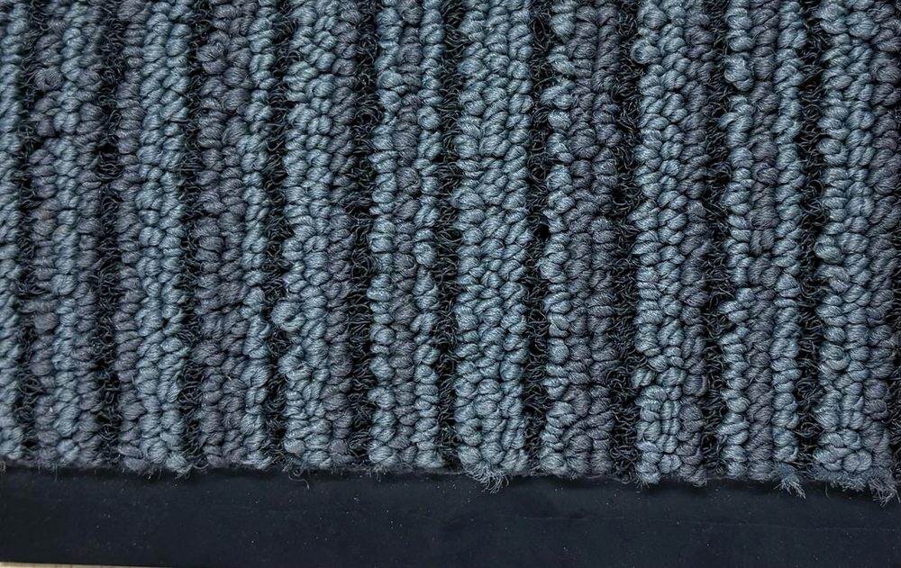 3M Nomad Aqua carpet-pile entrance mat with rubber edging